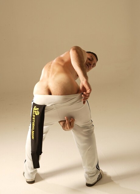 Hot athlete shows his perfect muscled body