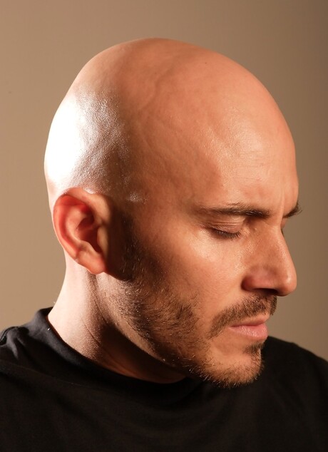 Bald hottie shows his uncut dick